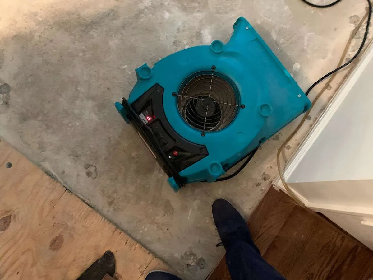 Air mover drying subfloor during Leak Detection & Repair in Miami
