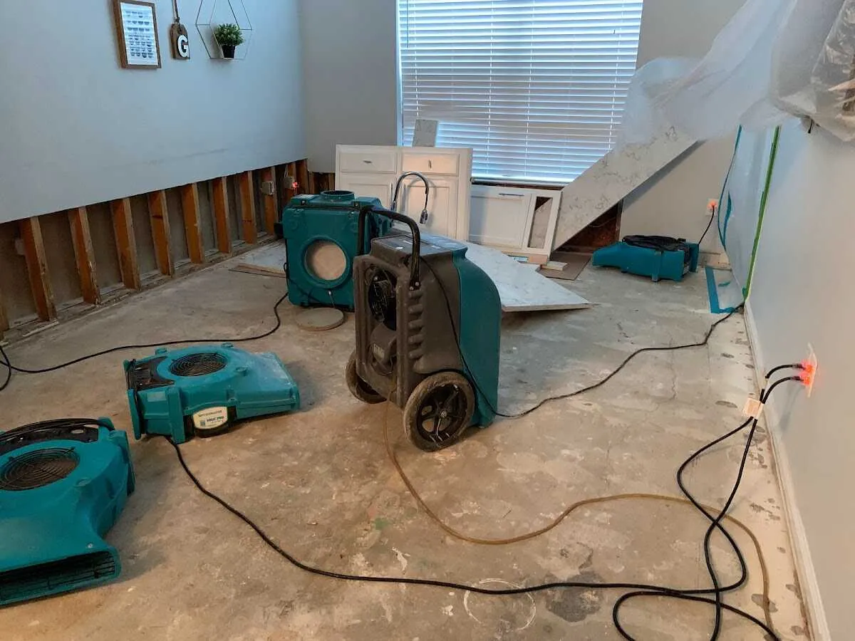 Dehumidifier in flood-cut room for Water Damage Restoration in Miami